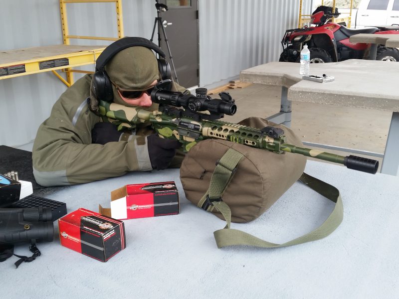 Black spider optics riflescope on the range.